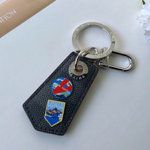 lv louis vuitton alpes small enchappe bag charm and key holder