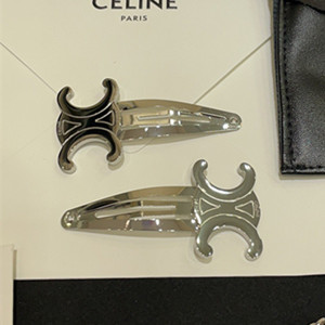 celine triomphe set of 2 snap hair clip in brass with rhodium finish and steel