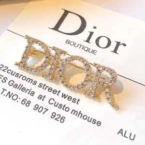 dior white crystal diorevolution gold finish brooch