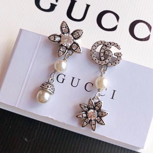 gucci flower and double g earrings with diamonds