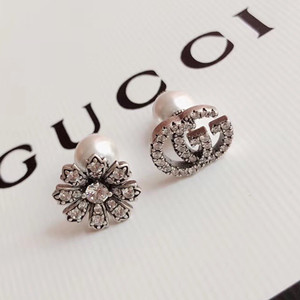 gucci flower and double g earring with diamonds