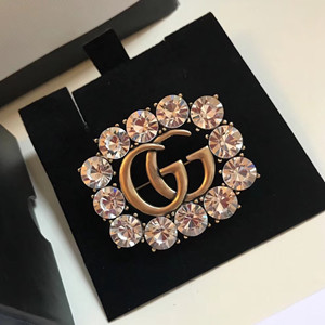 gucci metal double g brooch