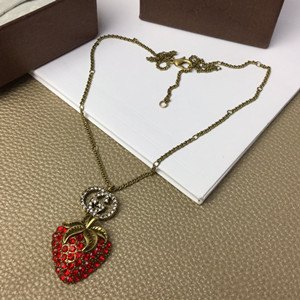 gucci necklace with strawberry pendant