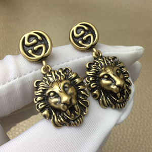 gucci metal lion head earrings